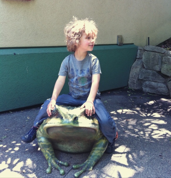 He always has to ride the frogs before we go inside at the Children's Zoo. 